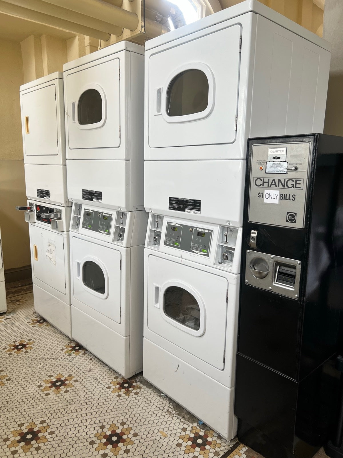 On-site resident laundry room with stacked machines, Exchange Building Memphis