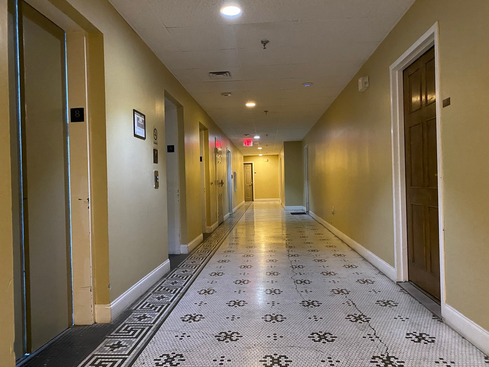 Residential corridor with original mosaic tile and elevators, Exchange Building Memphis